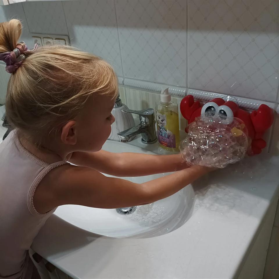 Zenélő, szappanbuborék készítő fürdőjáték - tarisznyarák erős tapadókoronggal, vidám dallamokkal